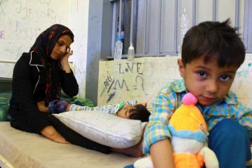 A mother and her children at a detention centre in Greece. Photo: UNHCR/J.Björgvinsson