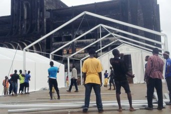 Construction workers race against time to finish another Ebola treatment unit in Monrovia, Liberia, adding another 200 beds to treat patients. Photo: WHO/P. Desloovere