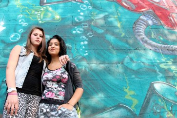 Daniela Cojocaru (left) and Chiara Dimastromatteo, both 16, stand next to a graffiti-covered wall in Turin, Italy. Daniela is originally from Moldova. Chiara does not attend school and does not have a job. Photo:UNICEF/Giacomo Pirozzi