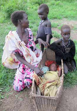 © UNICEF South Sudan/2014/Donovan | Cuaca walked with her children for 10 days from their hometown of Bor in bare feet, carrying her baby in a basket on her head and sleeping in the open with other fleeing women and children. 