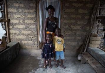 © UNICEF Sierra Leone/2014/Bindra | Mary, 15, at home with her brother and sister