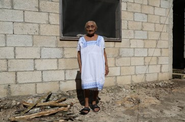  [An old person posing in front of her house in Chagas, Mexico, where long-lasting impregnated curtains were installed in order to keep the house free of the triamatone bugs. Photo: WHO/TDR /Isaias Montilla] An old person posing in front of her house in Chagas, Mexico, where long-lasting impregnated curtains were installed in order to keep the house free of the triamatone bugs. Photo: WHO/TDR /Isaias Montilla