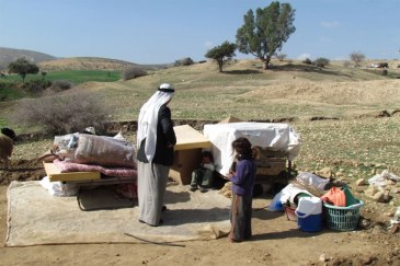 Displaced Palestinians with their belongings, following Israeli authorities demolition of their structures in Ein al Hilwa (Tubas Governorate) in the Jordan Valley on 30 January 2014. Photo: OCHA oPt