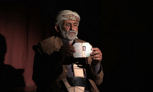 Abdullah Muhammad al-Tisi of Yakla holds a photo of his son Ali Abdullah Mohammed al-Tisi, who was killed in a US drone strike outside Rad`a, Yemen on December 12, 2013. © 2013 Human Rights Watch     Enlarge photo 