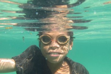 Young Timorese fisherman wearing his wooden goggles to catch fish along the shores of Atauro island off Dili. UN Photo/Martine Perret