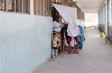 A family finds temporary shelter at a school in Aden Governorate, Yemen. Photo: OCHA/Eman al Awami (file)