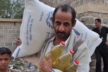 A farmer collects food ration for his family. An estimated 12 million Yemenis are food insecure. Photo: WFP | UN