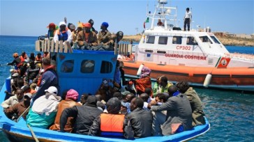 ***Photo: Kate Thomas/IRIN | A boat carrying migrants arrives in Lampedusa from Libya (file photo)
