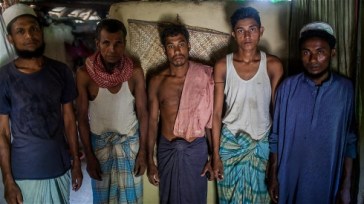 **Photo: S.H.Omi/UNHCR | A day or two before departing on a smuggler's boat, a group of Rohingya gather at a safe house.