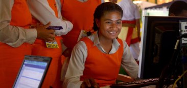 Students from Tonga's Tailulu College making the most of new high-speed broadband services at 2013 World Telecommunication and Information Society Day celebrations in the the Tongan capital, Nuku'alofa. | Nukua'lofa, Tonga Photo: Tom Perry / World Bank | Source: UN Women Project: P113184