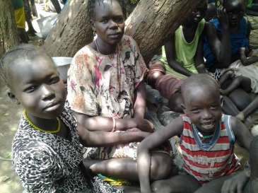 © UNHCR/R.R.Thot |  A South Sudanese woman and her two children rest under a tree after fleeing their country and crossing into Ethiopia at the Pagak border entry point earlier this week.