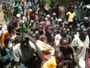 © UNHCR/R.Riek |  South Sudanese refugees wait to be registered at a crossing into Ethiopia earlier this year.