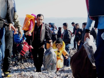 A migrant family comes ashore at Sklala Sykaminias. The majority of arrivals to Greece are Syrians, followed by Afghans. 