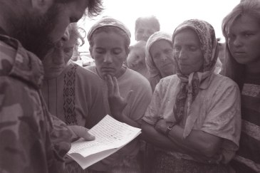 In 1995, a government soldier reads out the names of soldiers who are confirmed survivors or escapees from the fallen city of Srebrenica. UNICEF/NYHQ1995-0553/LeMoyne