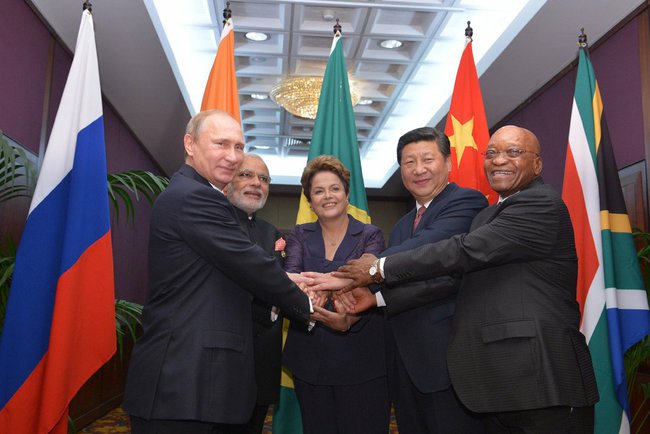BRICS_heads_of_state_and_government_hold_hands_ahead_of_the_2014_G-20_summit_in_Brisbane,_Australia