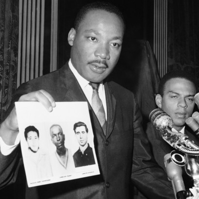 Martin-Luther-King-displays-pictures-of-three-civil-rights-workers-murdered-Cheney-Goodman-and